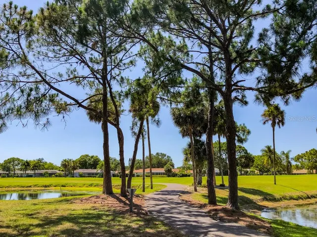 a view of a lake with a building in the background
