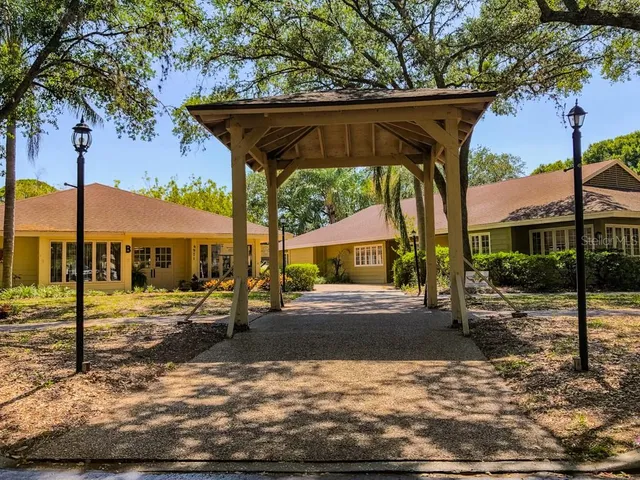 a front view of a building with garden