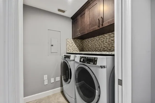 a utility room with dryer and washer