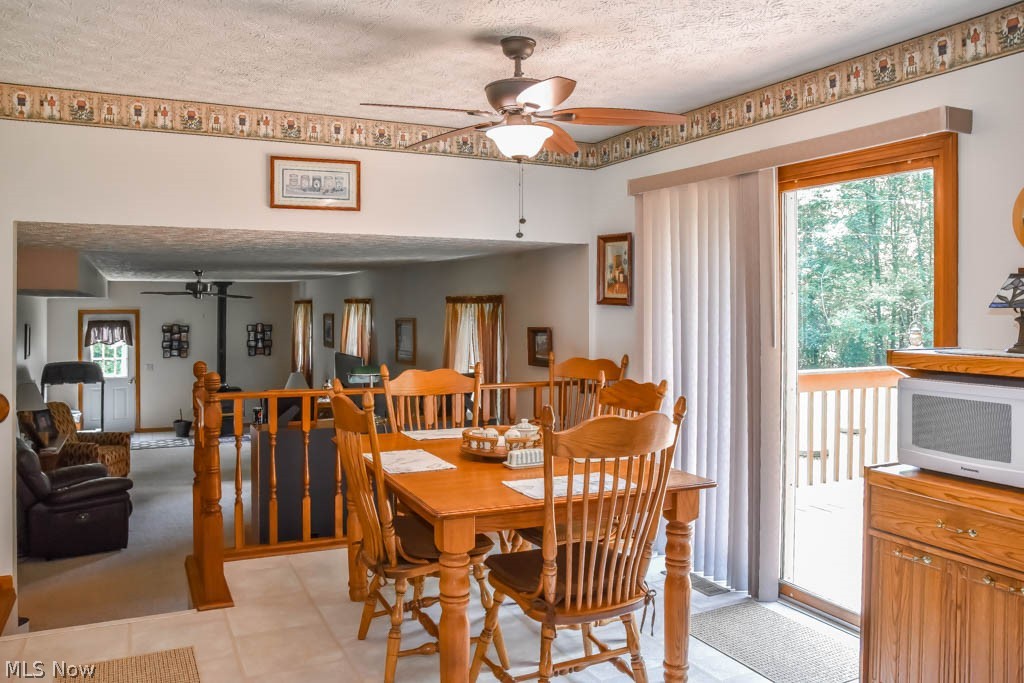 1175 Granada Road Northwest Dellroy, OH 44620 - Photo 7 of 28 Dinette with a sliding door to the deck.