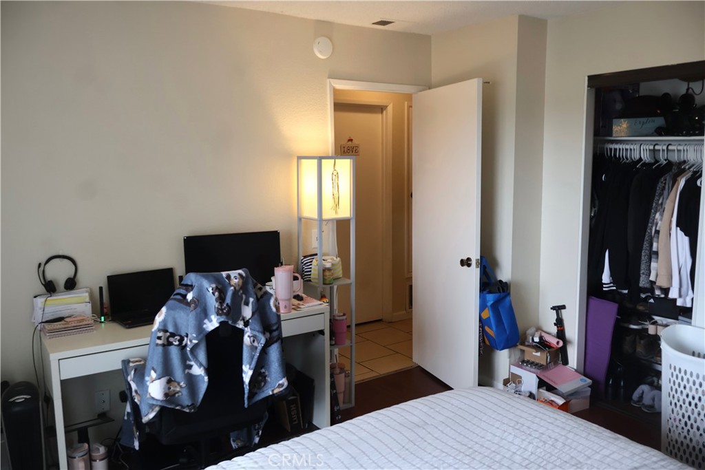 25929 Baylor Way Hemet, CA 92544 - Photo 16 of 21 a living room with furniture a flat screen tv and a fireplace