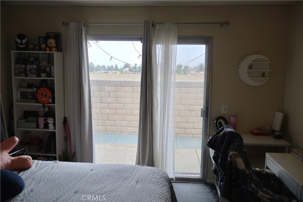 25929 Baylor Way Hemet, CA 92544 - Photo 17 of 21 a bedroom with a bed and a window