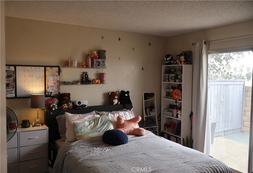 25929 Baylor Way Hemet, CA 92544 - Photo 18 of 21 a bedroom with a bed and closet