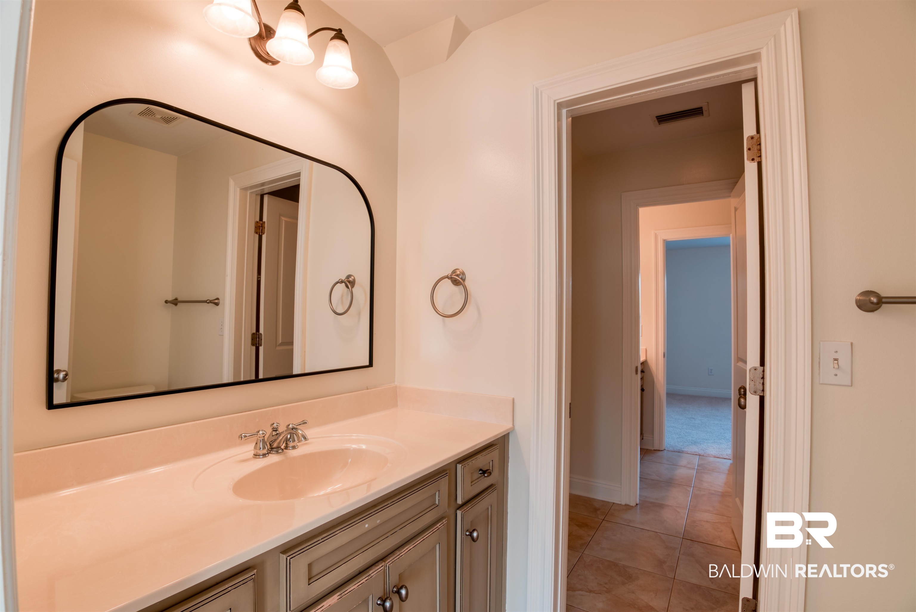 24561 Austin Road Daphne, AL 36526 - Photo 33 of 57 Bathroom with tile patterned floors and vanity