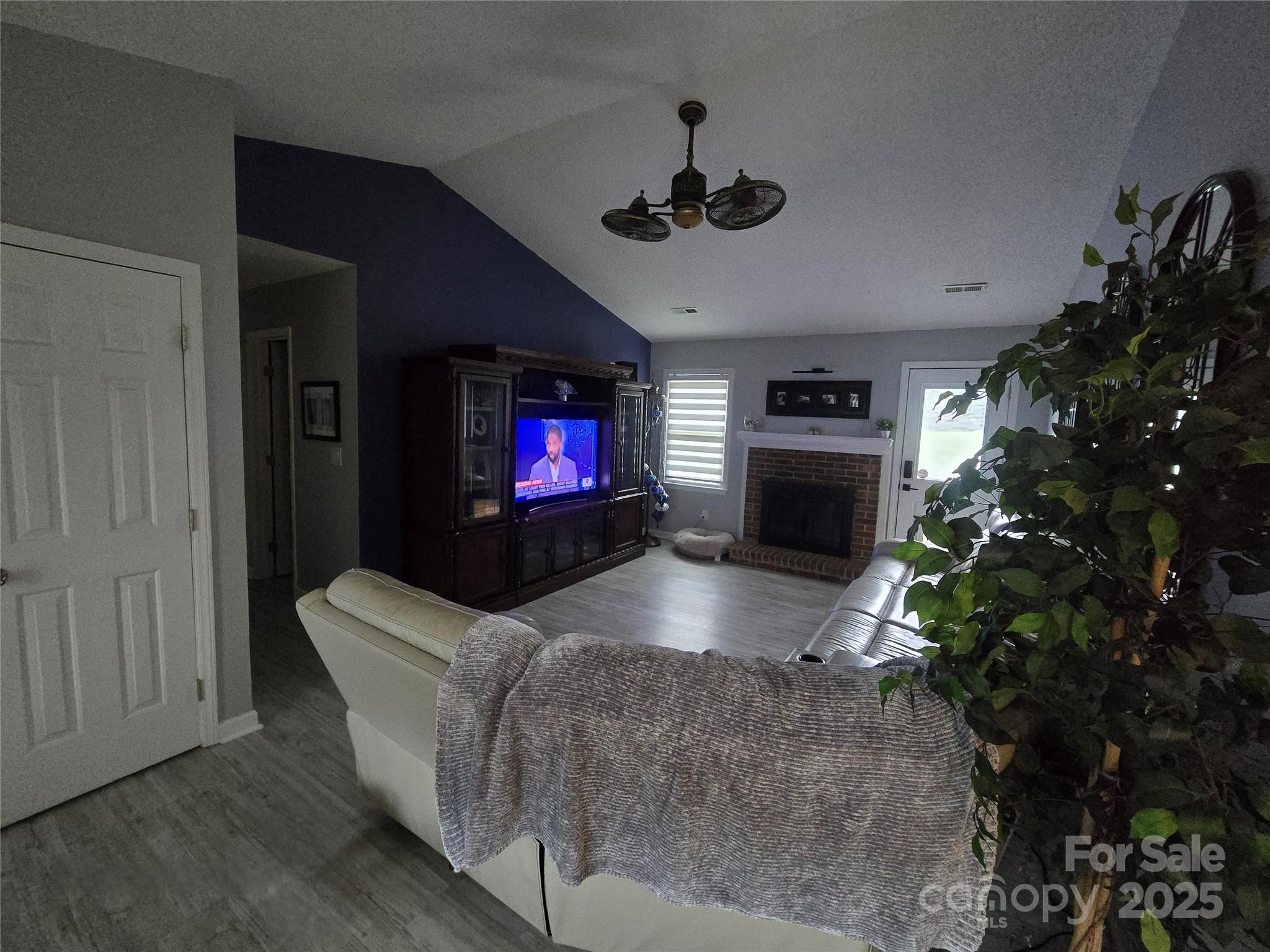 5202 Robin Lane Randleman, NC 27317 - Photo 18 of 48 a living room with furniture a flat screen tv and a fireplace