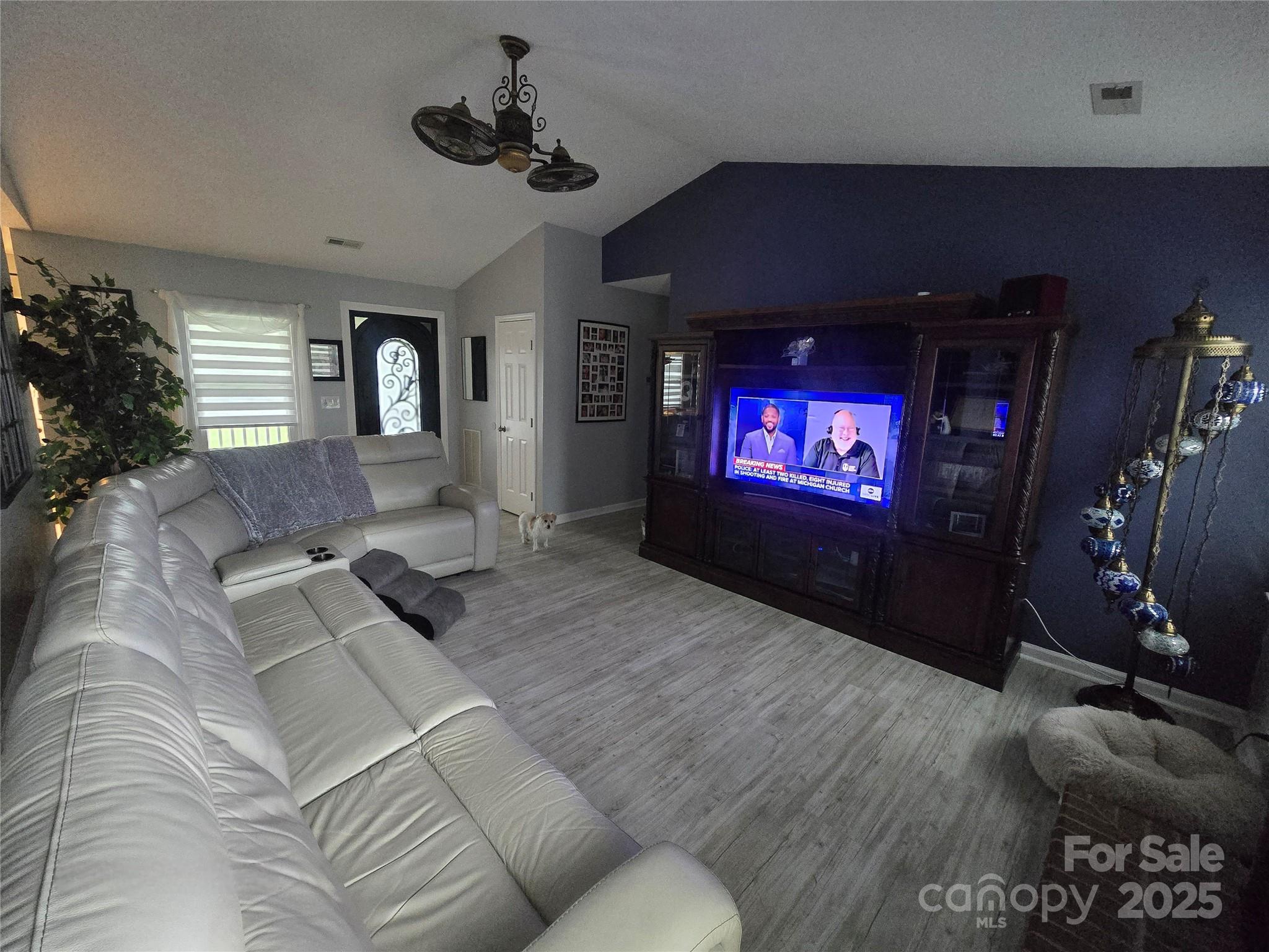 5202 Robin Lane Randleman, NC 27317 - Photo 20 of 48 a living room with furniture and a flat screen tv