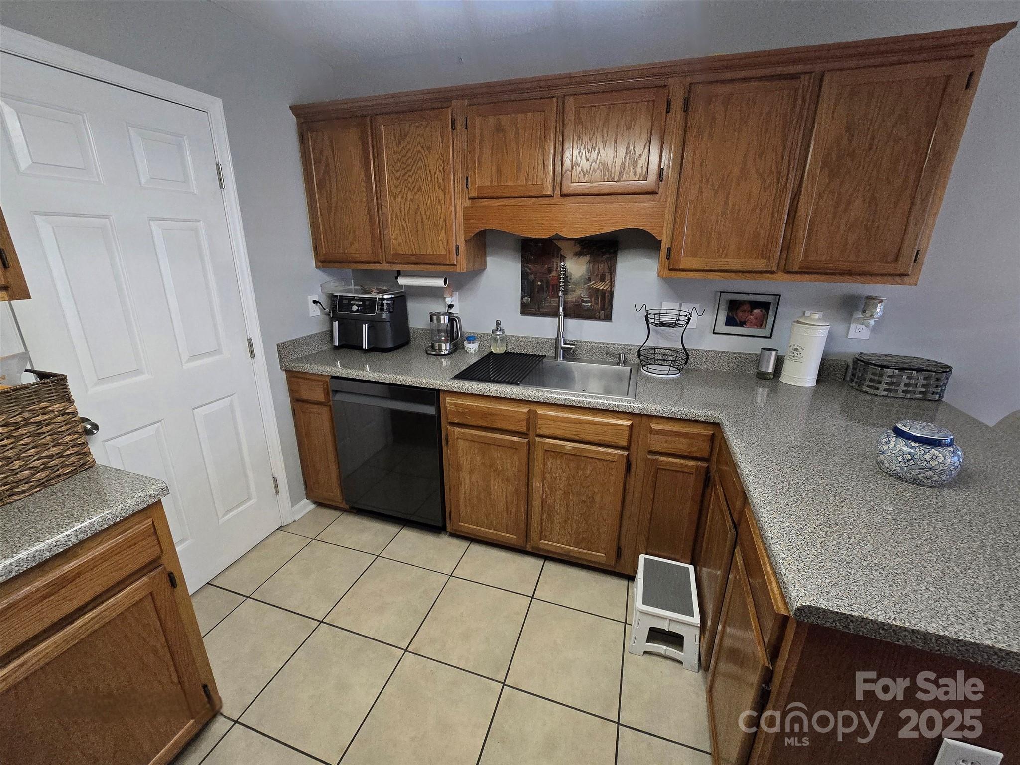 5202 Robin Lane Randleman, NC 27317 - Photo 28 of 48 a kitchen with a sink a stove and cabinets
