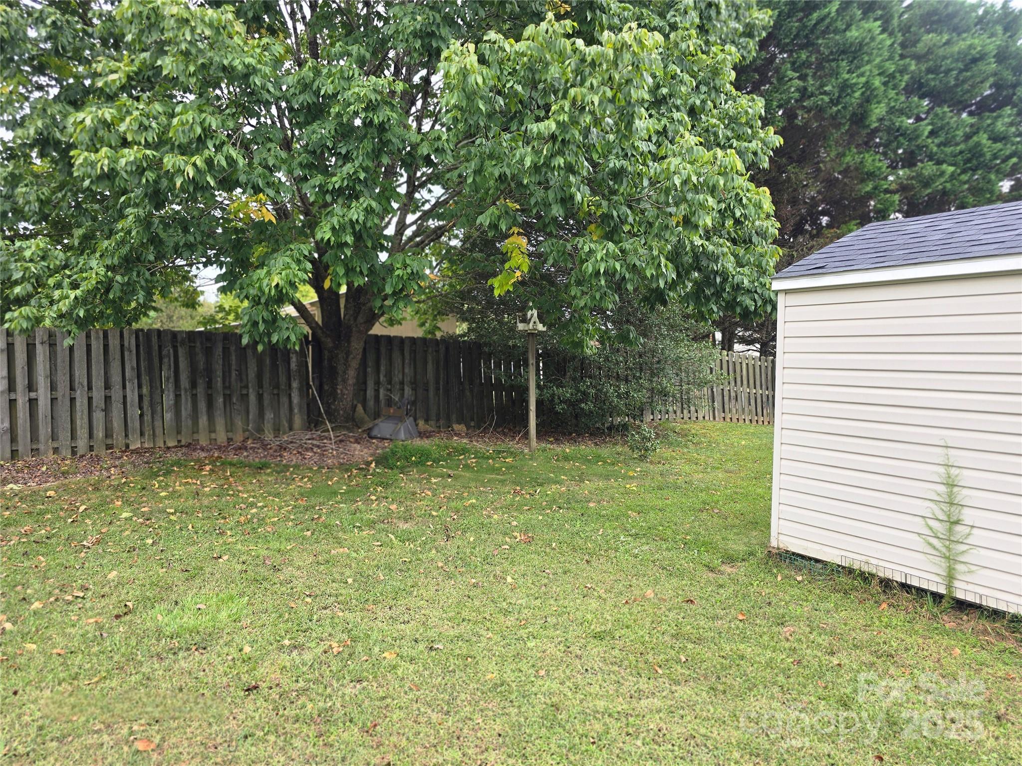 5202 Robin Lane Randleman, NC 27317 - Photo 40 of 48 a backyard of a house with swimming pool and trees