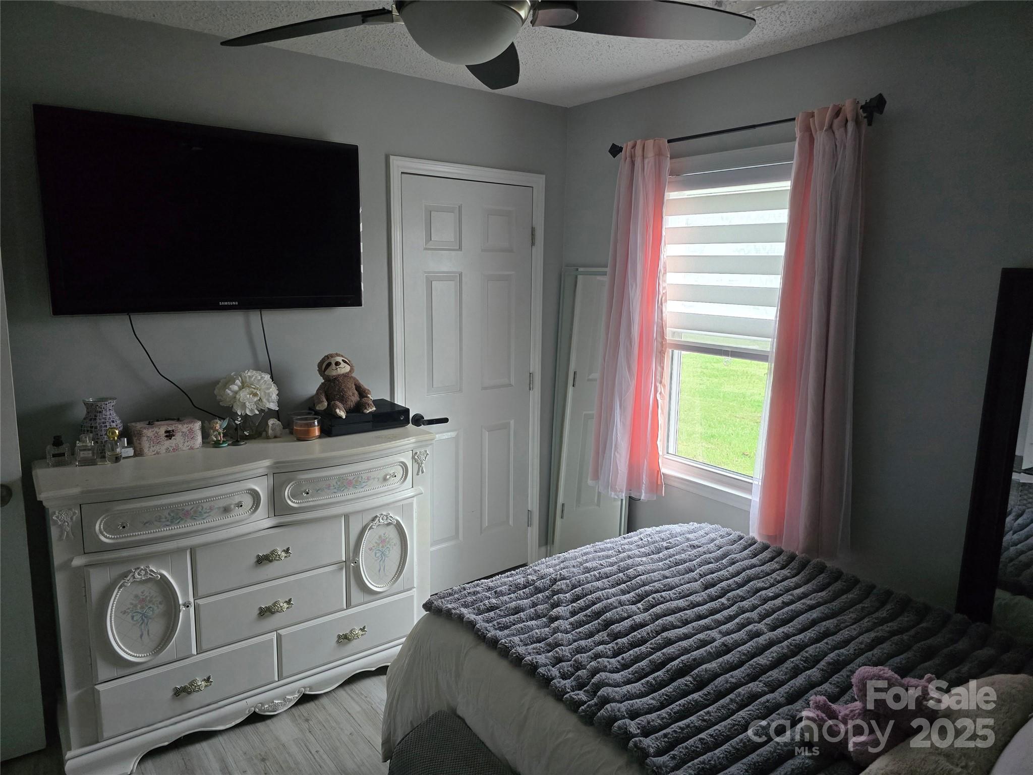 5202 Robin Lane Randleman, NC 27317 - Photo 4 of 48 a bedroom with a bed and flat screen tv