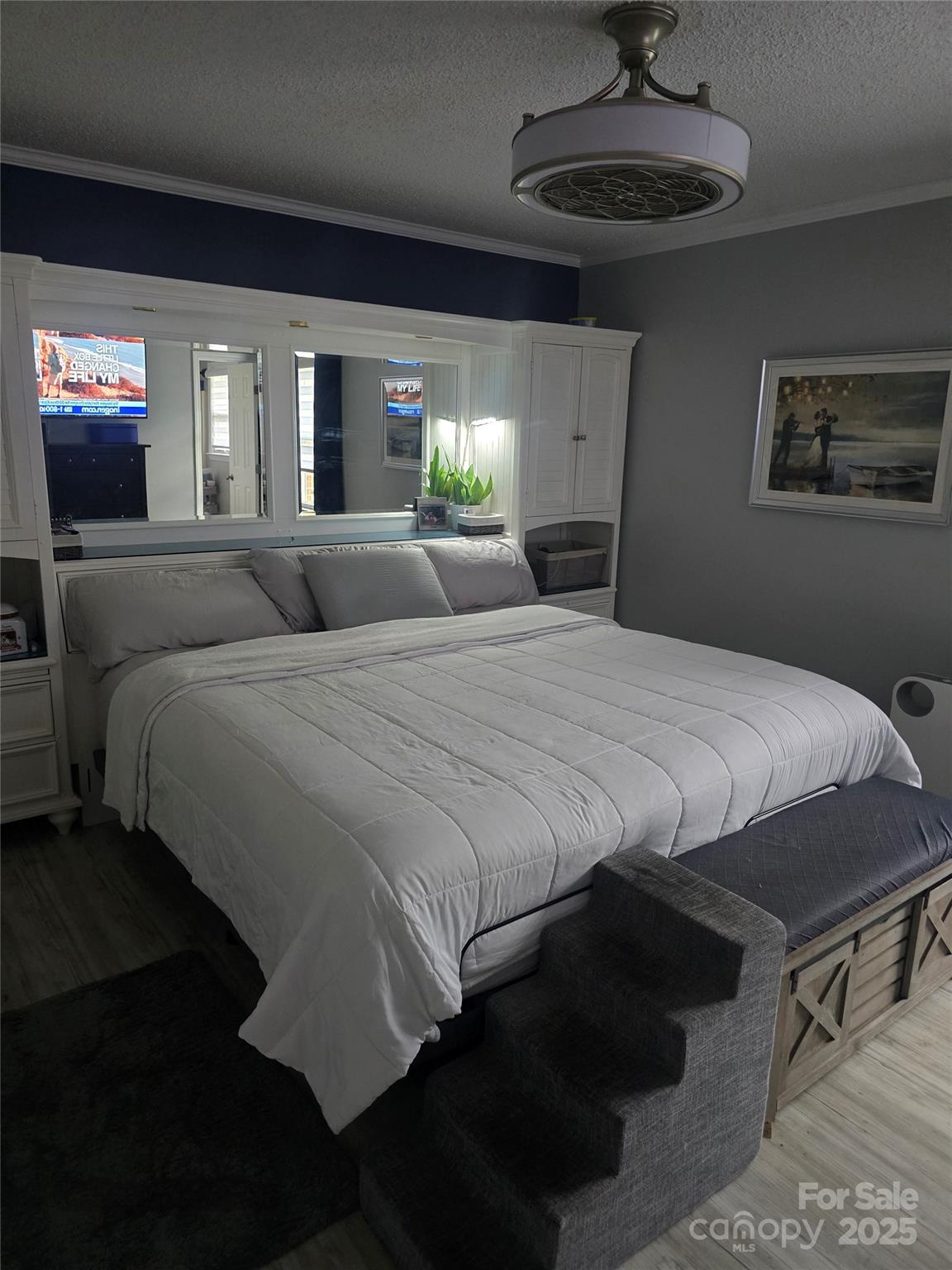 5202 Robin Lane Randleman, NC 27317 - Photo 45 of 48 a bedroom with a bed and a chandelier