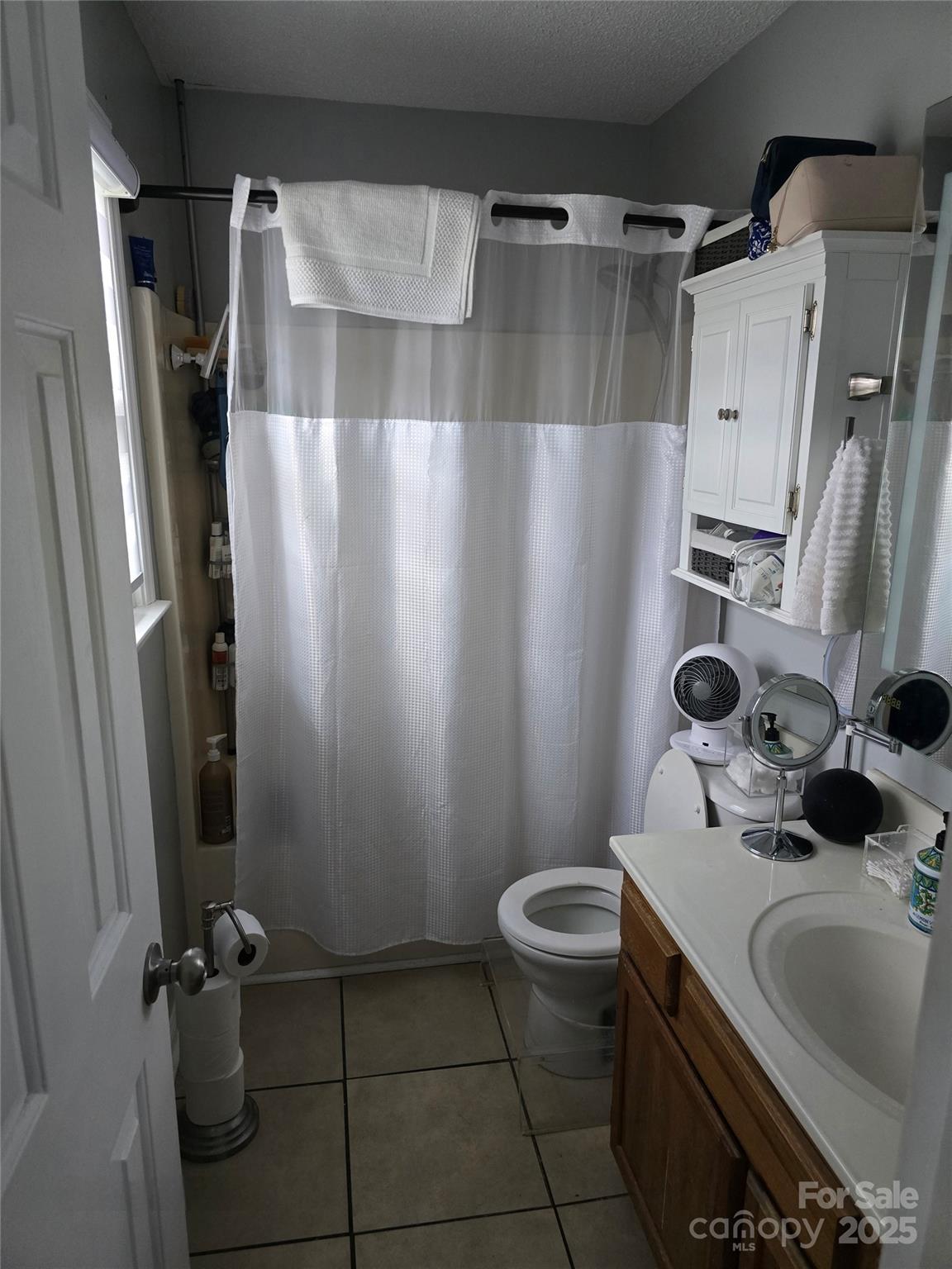 5202 Robin Lane Randleman, NC 27317 - Photo 5 of 48 a bathroom with a sink toilet and shower