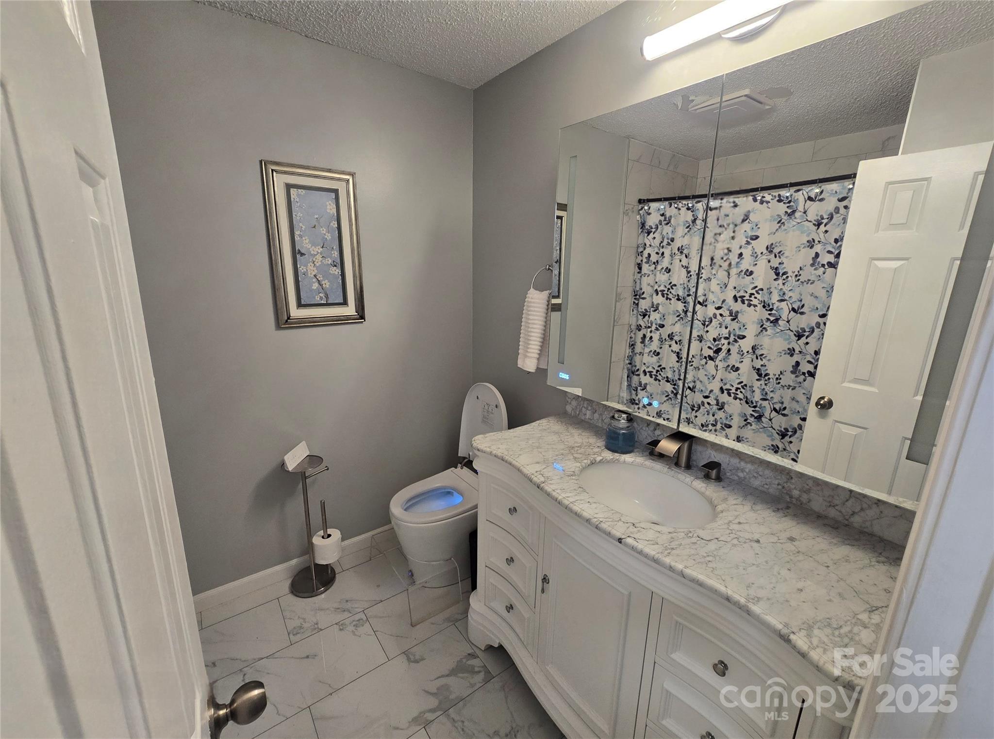 5202 Robin Lane Randleman, NC 27317 - Photo 9 of 48 a bathroom with a granite countertop sink toilet and shower