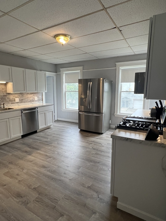 8 Knowlton Avenue, Unit 2 Worcester, MA 01603 - Photo 5 of 14 a kitchen with stainless steel appliances granite countertop a stove and a refrigerator