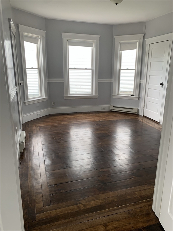 8 Knowlton Avenue, Unit 2 Worcester, MA 01603 - Photo 7 of 14 a view of empty room with wooden floor and fan