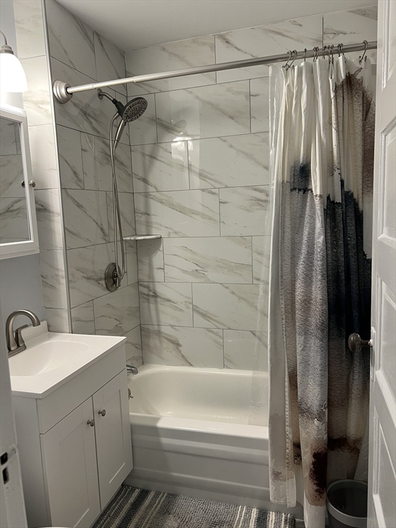 8 Knowlton Avenue, Unit 2 Worcester, MA 01603 - Photo 9 of 14 a bathroom with a shower and a tub