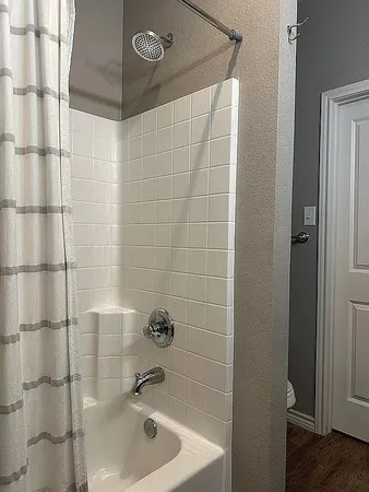 a bathroom with a sink and shower