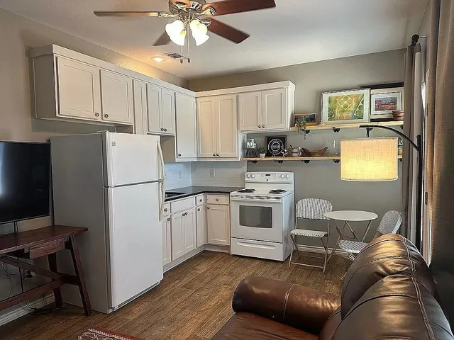 a kitchen with a refrigerator stove and sink