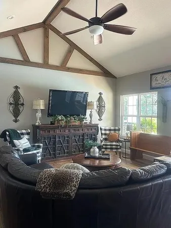 a living room with furniture and a flat screen tv