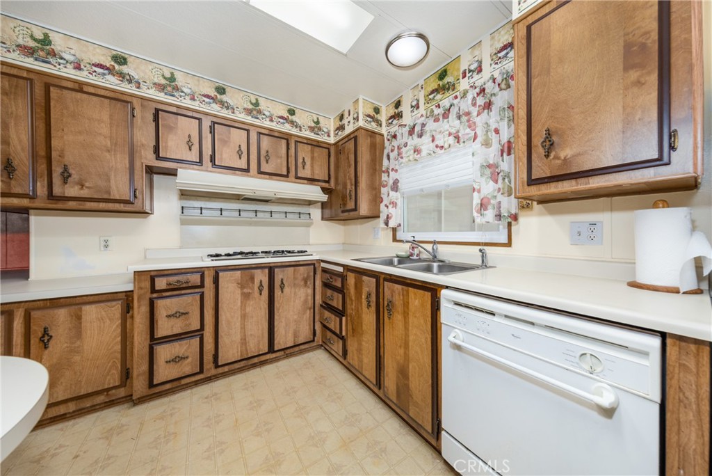 9401 Sharondale Road Calimesa, CA 92320 - Photo 11 of 23 a kitchen with stainless steel appliances granite countertop a sink and cabinets