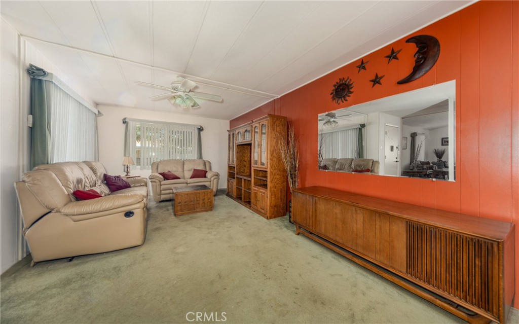9401 Sharondale Road Calimesa, CA 92320 - Photo 14 of 23 a living room with furniture and a large window