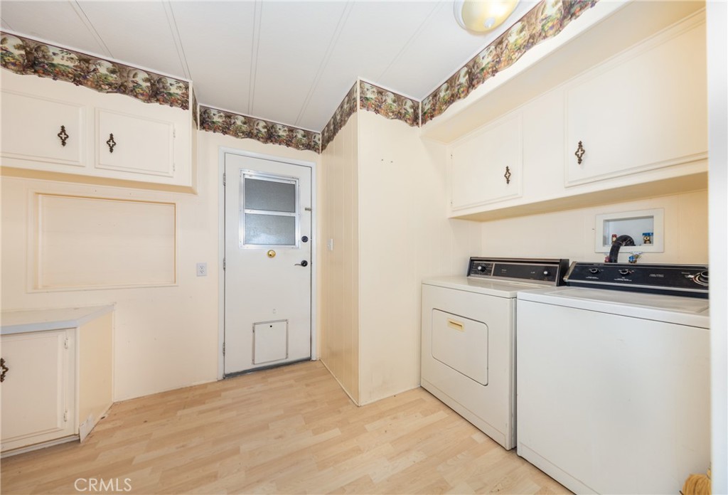 9401 Sharondale Road Calimesa, CA 92320 - Photo 15 of 23 a kitchen with white cabinets and white appliances