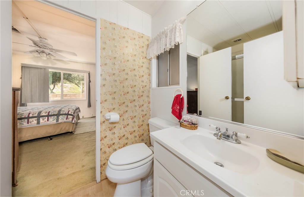9401 Sharondale Road Calimesa, CA 92320 - Photo 17 of 23 a bathroom with a sink toilet and shower