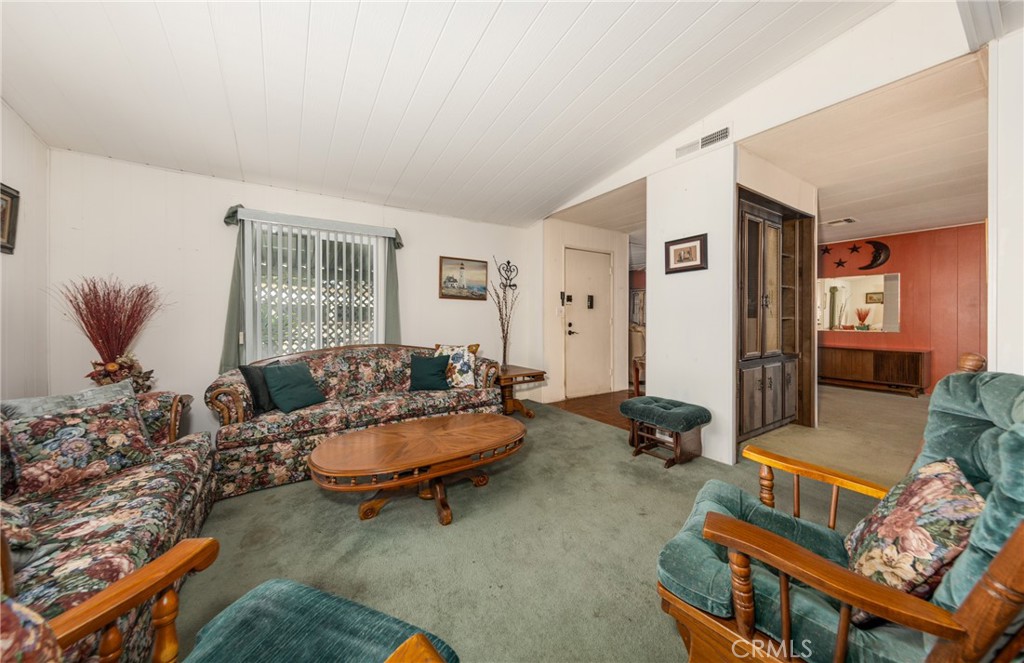 9401 Sharondale Road Calimesa, CA 92320 - Photo 8 of 23 a living room with furniture and a window