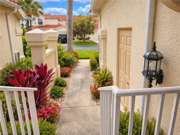 a view of a house with a flower garden
