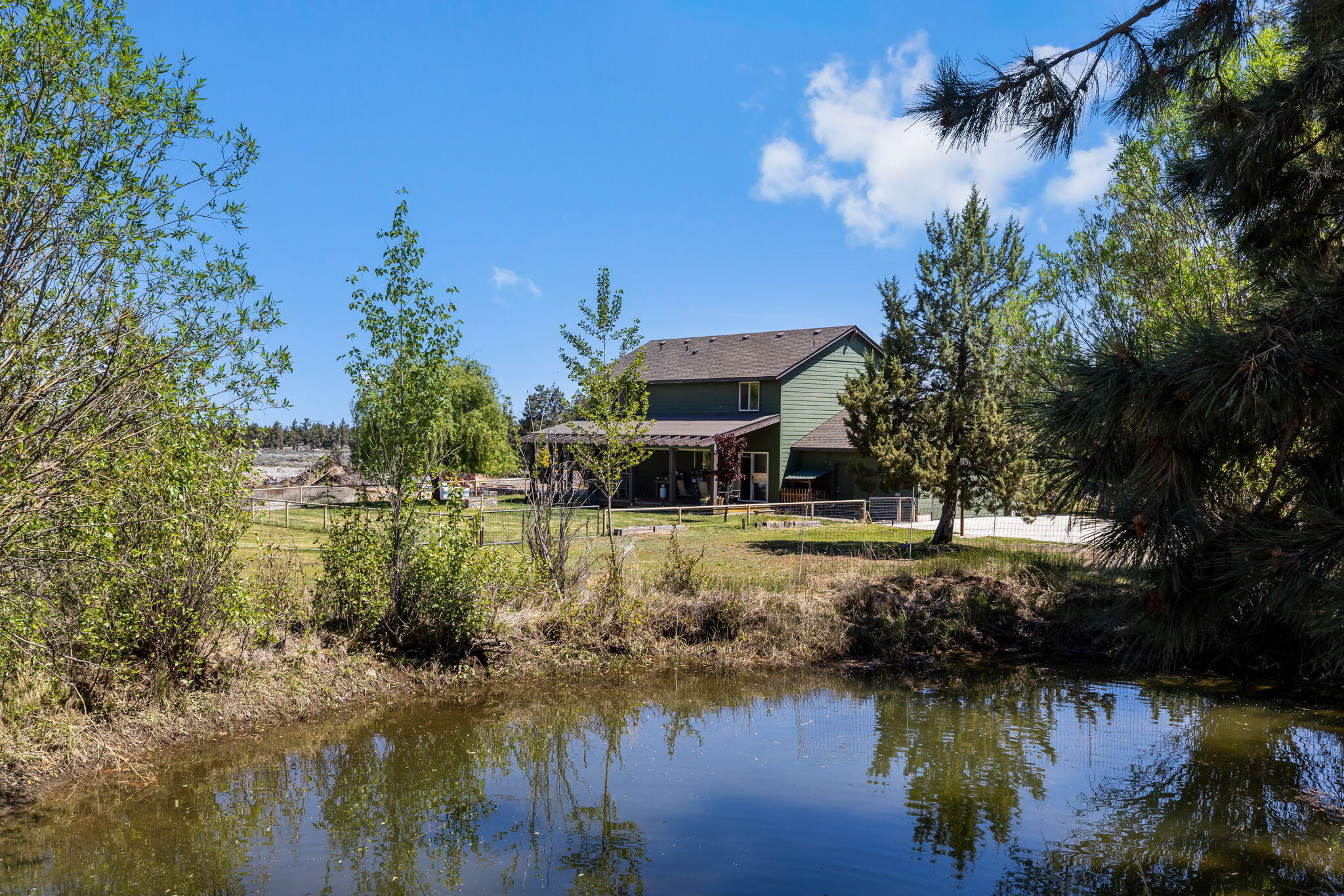 63639 Gentry Loop Bend, OR 97701 - Photo 29 of 40 a view of a lake with houses