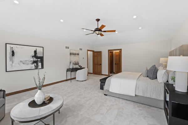 1 Hidden Lake Drive Burr Ridge, IL 60527 - Photo 11 of 24 a bedroom with furniture and a chandelier