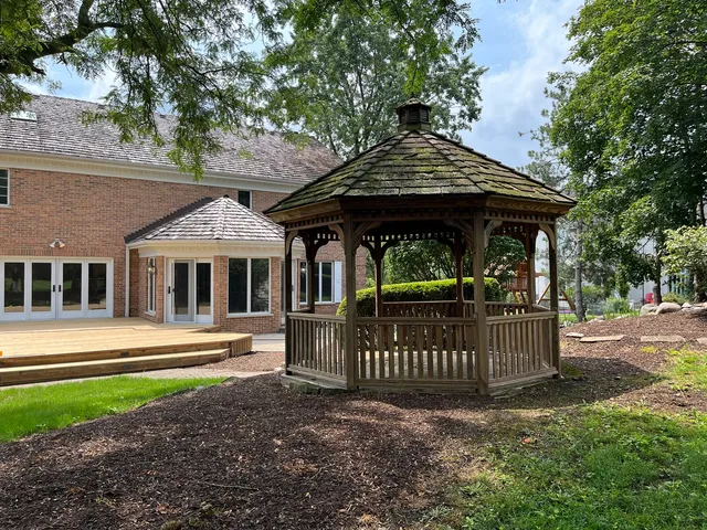 a view of a backyard with a patio