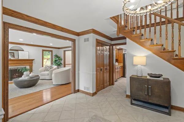 a view of living room filled with furniture and stairs