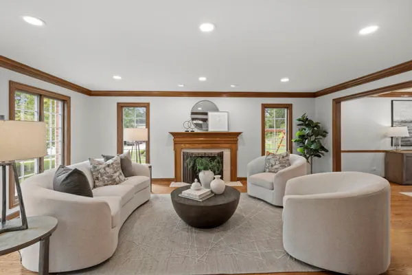 a living room with furniture and a fireplace