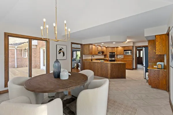 a dining room with furniture and window