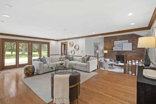1 Hidden Lake Drive Burr Ridge, IL 60527 - Photo 8 of 24 a living room with furniture and a large window