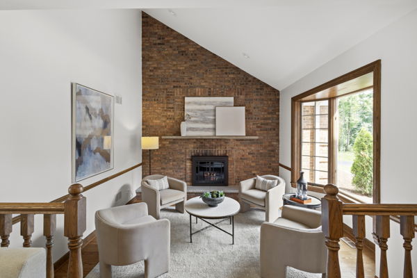 1 Hidden Lake Drive Burr Ridge, IL 60527 - Photo 9 of 24 a living room with furniture a fireplace and a large window
