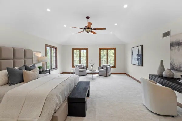 a bedroom with furniture and a chandelier