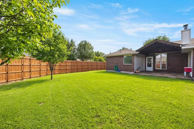 a bedroom with a bed and a television