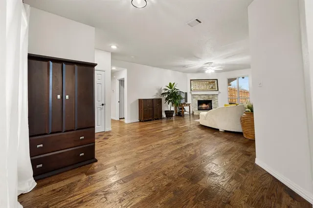 a living room with furniture and a mirror
