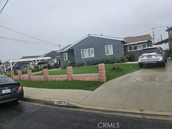 a kitchen with a sink a stove and cabinets
