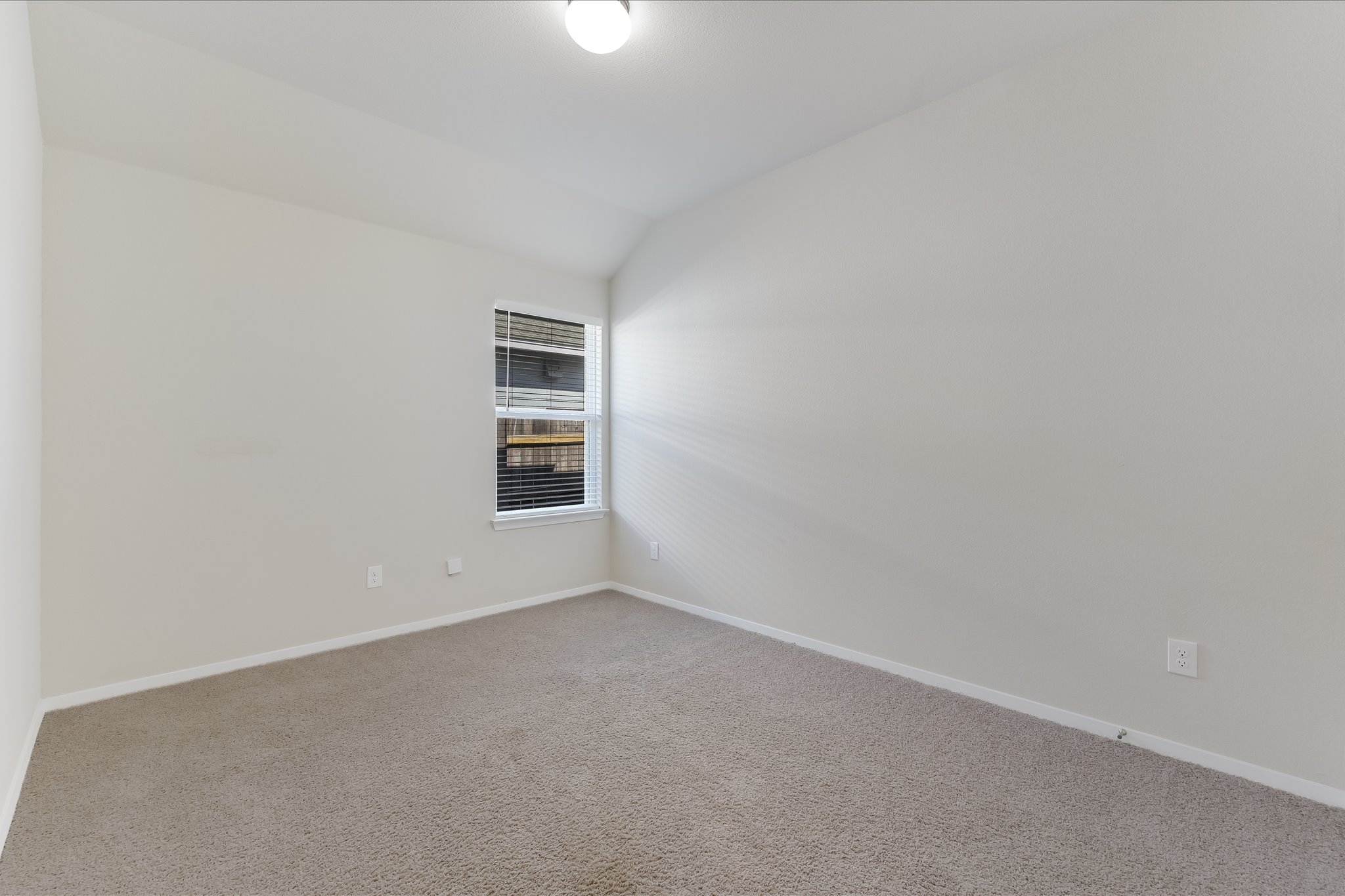 201 Spiny Lizard Lane San Marcos, TX 78666 - Photo 17 of 20 a view of an empty room with a window
