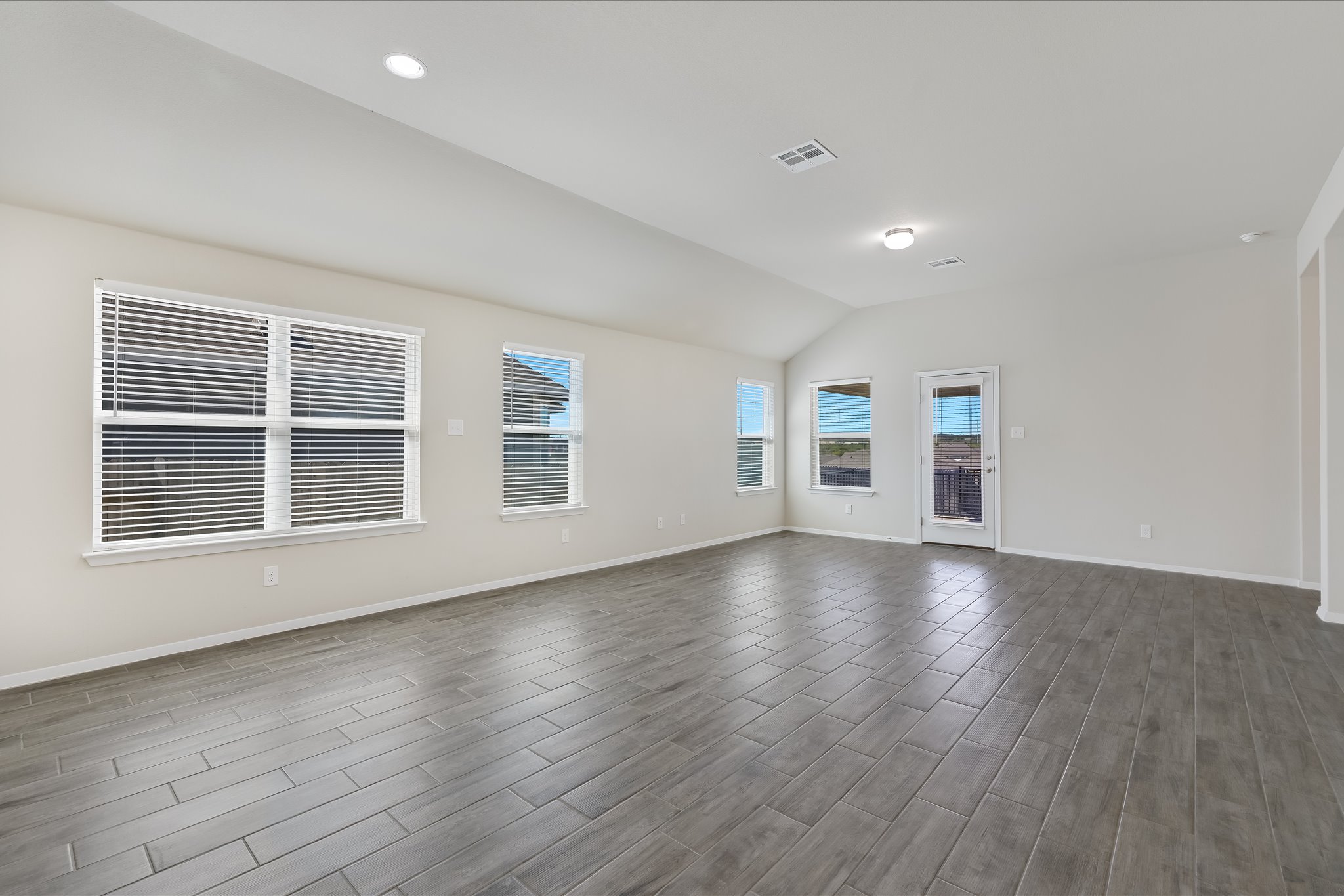201 Spiny Lizard Lane San Marcos, TX 78666 - Photo 6 of 20 a view of empty room with wooden floor and fan