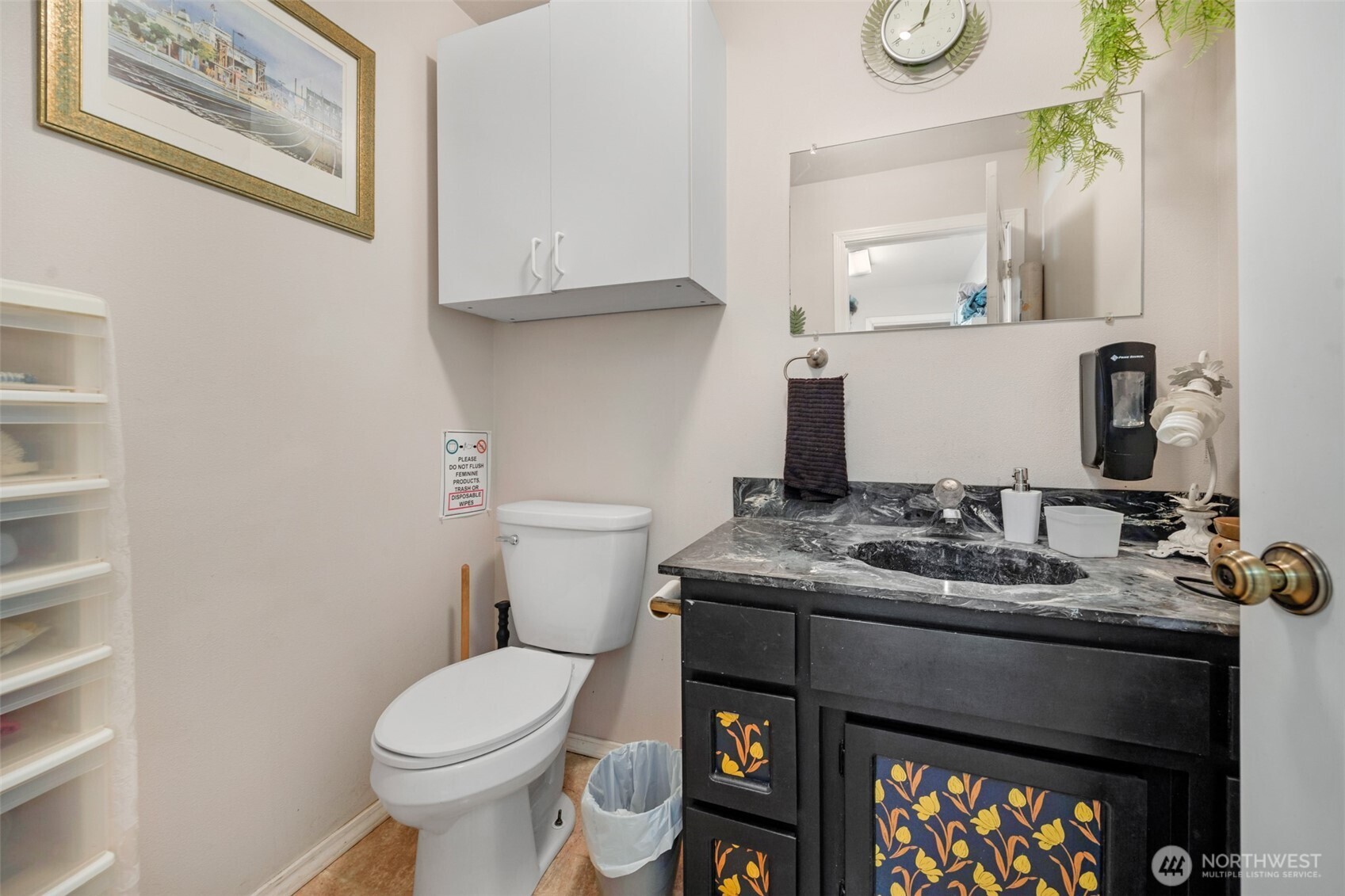 525 192nd Place Southeast Bothell, WA 98012 - Photo 13 of 18 a bathroom with a sink toilet and mirror