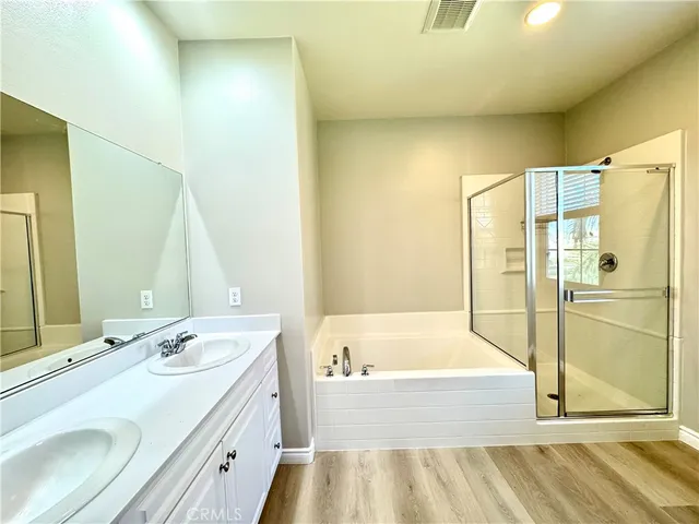 a bathroom with a bathtub and a sink