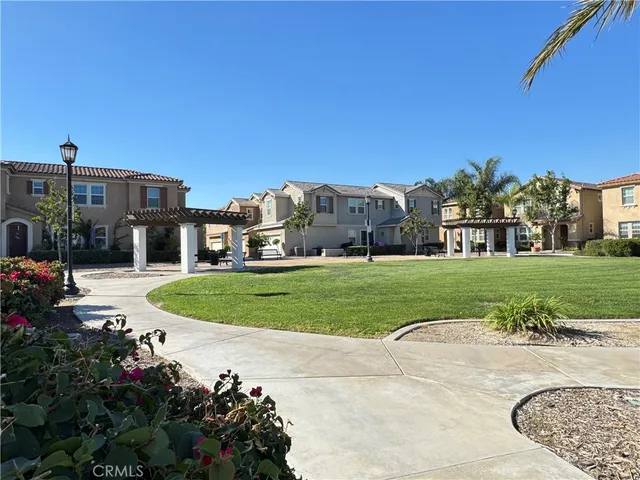 a view of swimming pool with lounge chair and dinning table