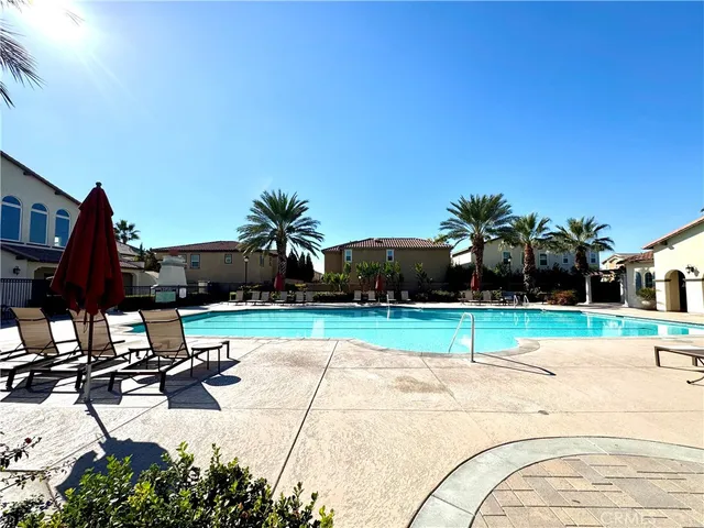 a view of a house with wooden deck front of house