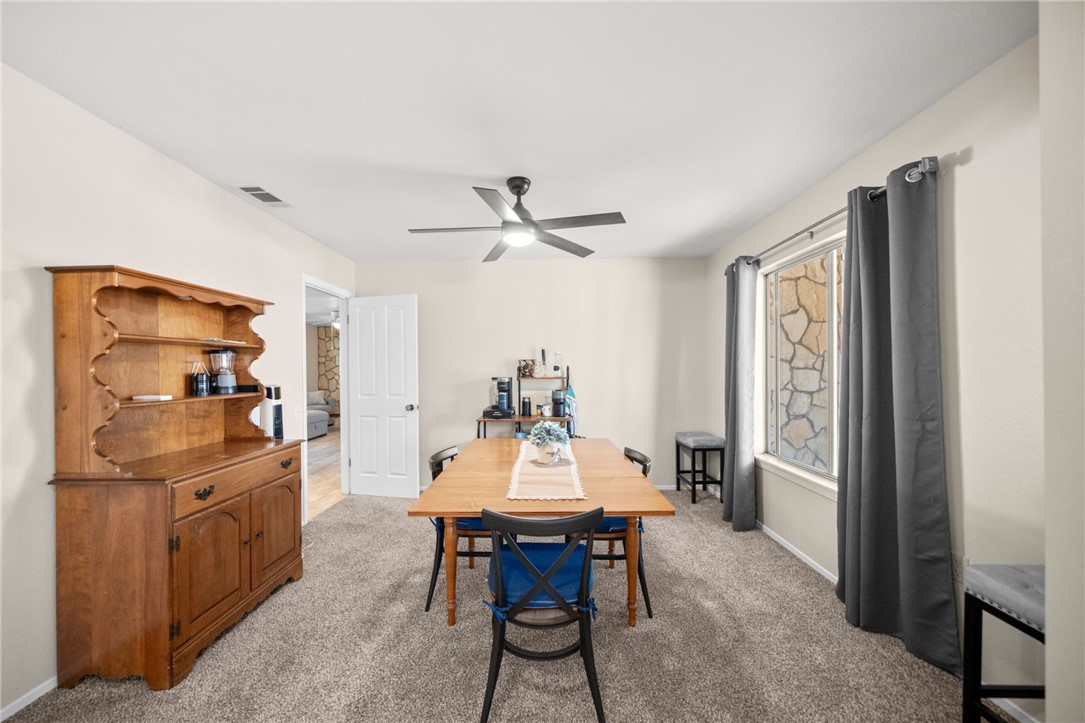27879 Foxfire Street Menifee, CA 92586 - Photo 13 of 36 a dining room with furniture and window