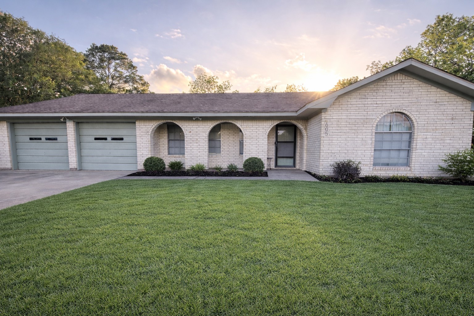 605 Clear Spring Drive Brenham, TX 77833 - Photo 22 of 22 a front view of a house with a garden