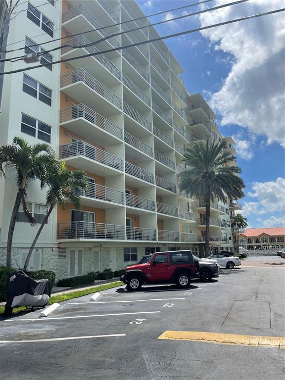 2900 Northeast 30th Street, Unit B2 Fort Lauderdale, FL 33306 - Photo 18 of 31 a car parked in front of a building