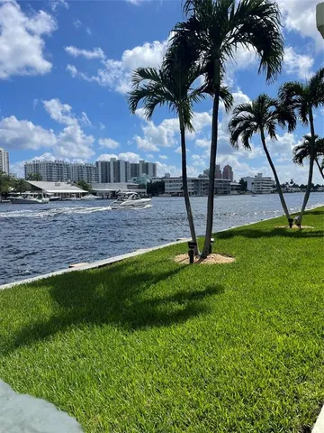 a view of outdoor space with playground and green space